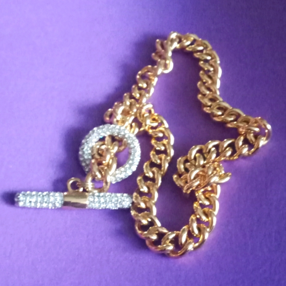 Necklace gold chain/ diamond like crystals/ added bracelet that looks the same.